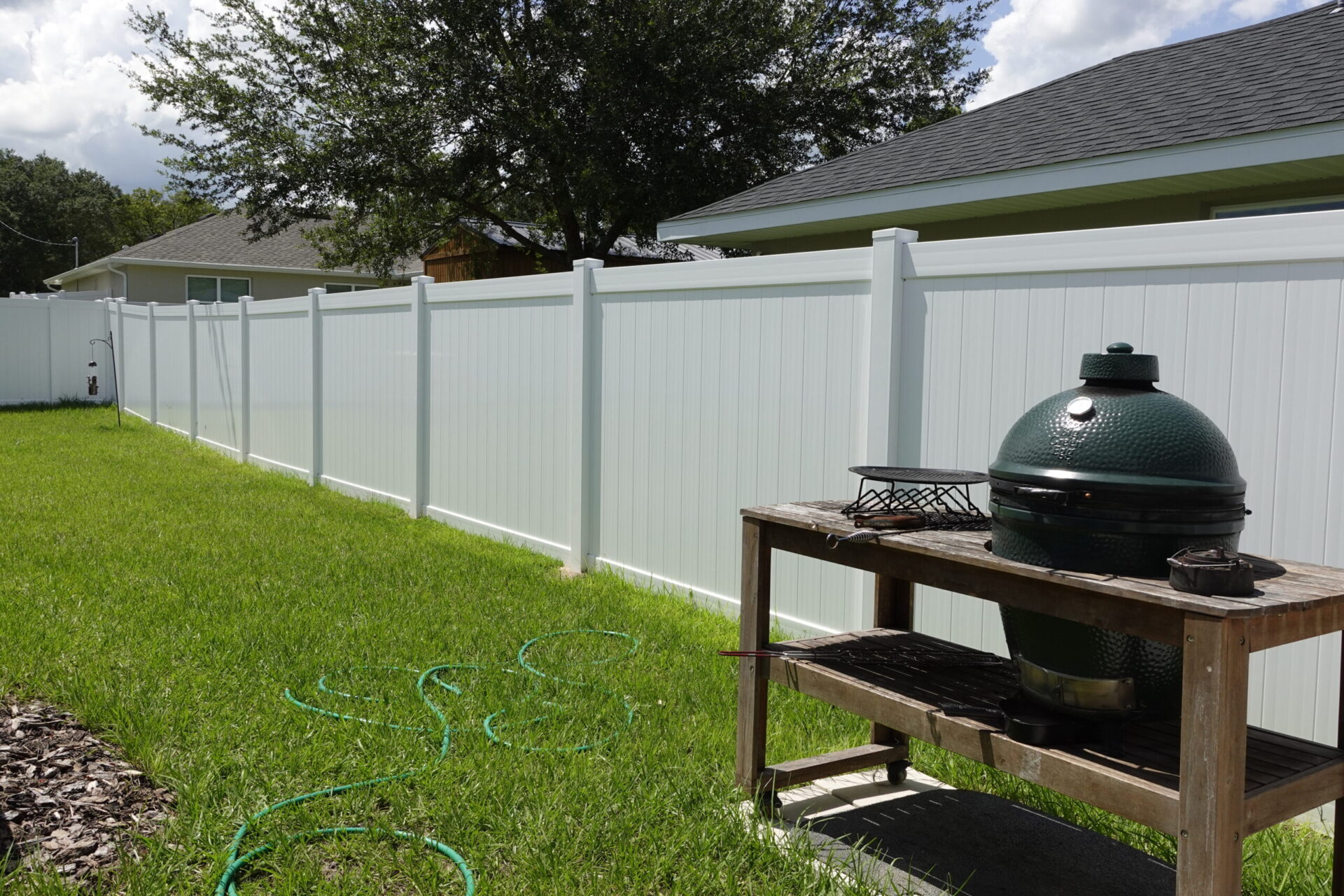 White vinyl fencing installed in a backyard in ocala florida