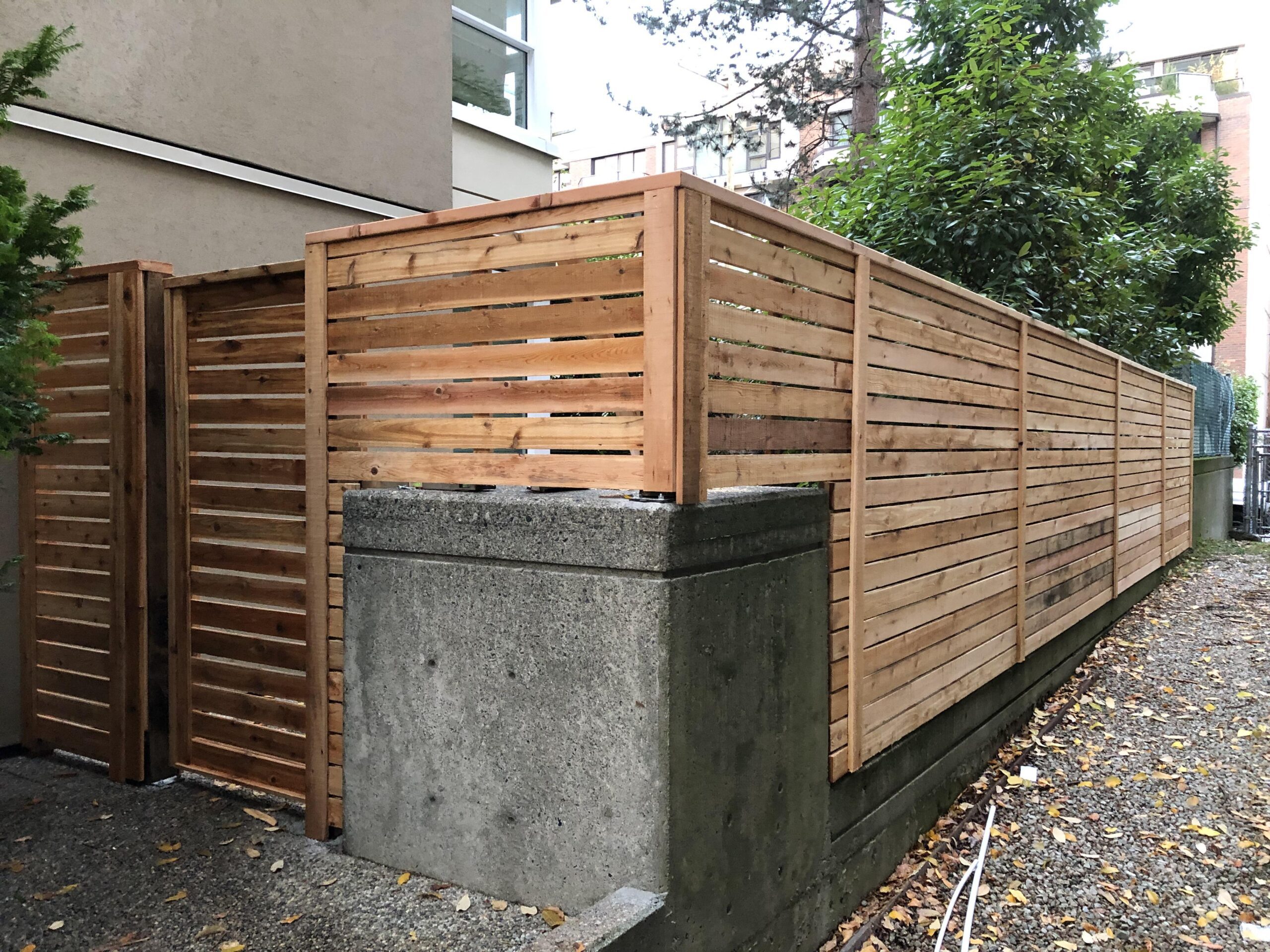Horizontal wood privacy fence installed on a residential property in Central Florida