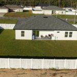 Vinyl fence installed around a residential backyard in Central Florida
