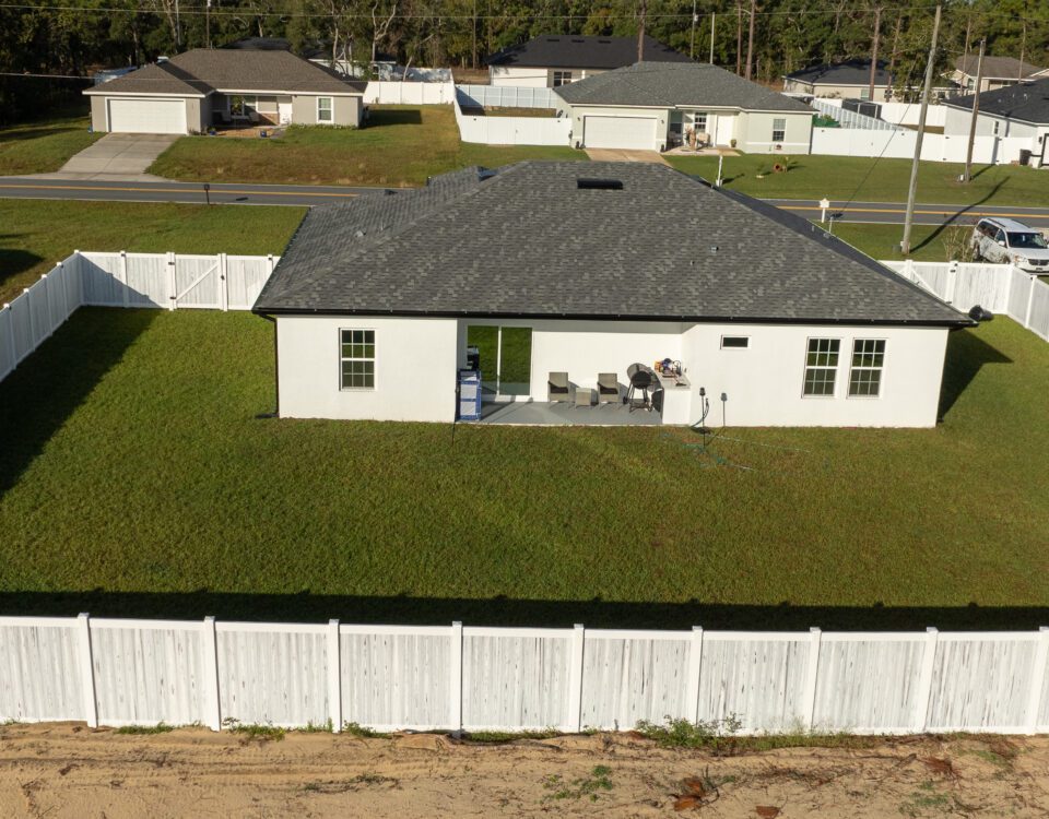 Vinyl fence installed around a residential backyard in Central Florida