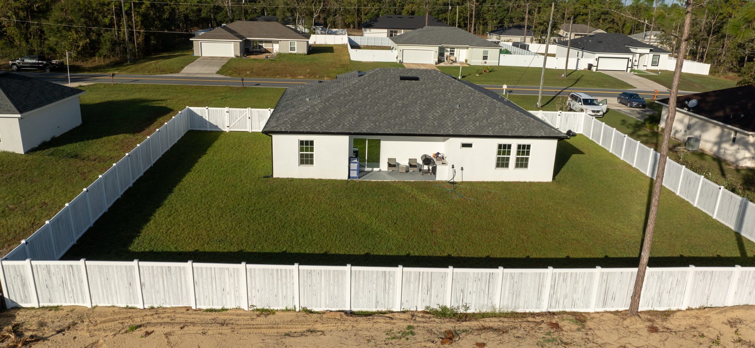 Vinyl fence installed around a residential backyard in Central Florida