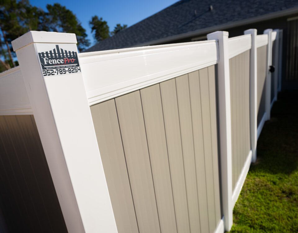 Close-up of vinyl fence panel and post showing durable construction
