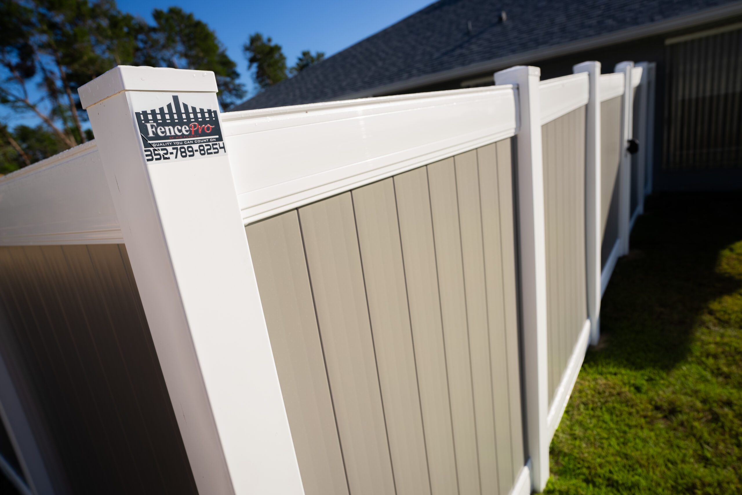 Close-up of vinyl fence panel and post showing durable construction